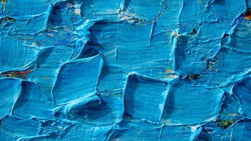 Thick blue paint texture with visible brushstrokes.