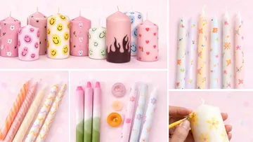 Colorful patterned candles on pink background.