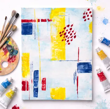 Abstract painting with brushes and paint tubes.