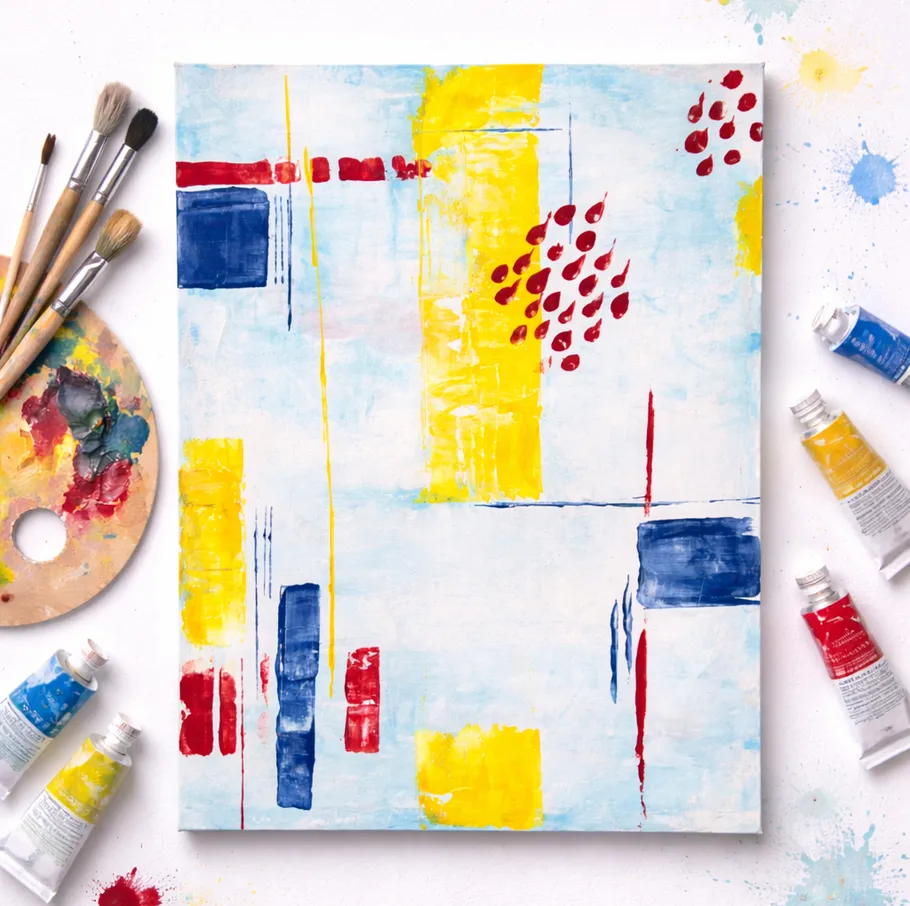 Abstract painting with brushes and paint tubes.