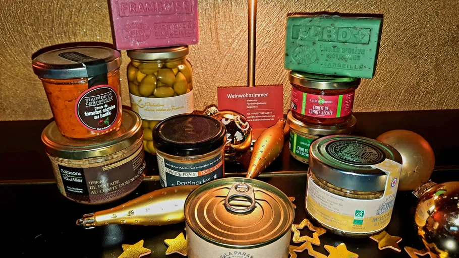 Assorted gourmet jars and soaps on a table.