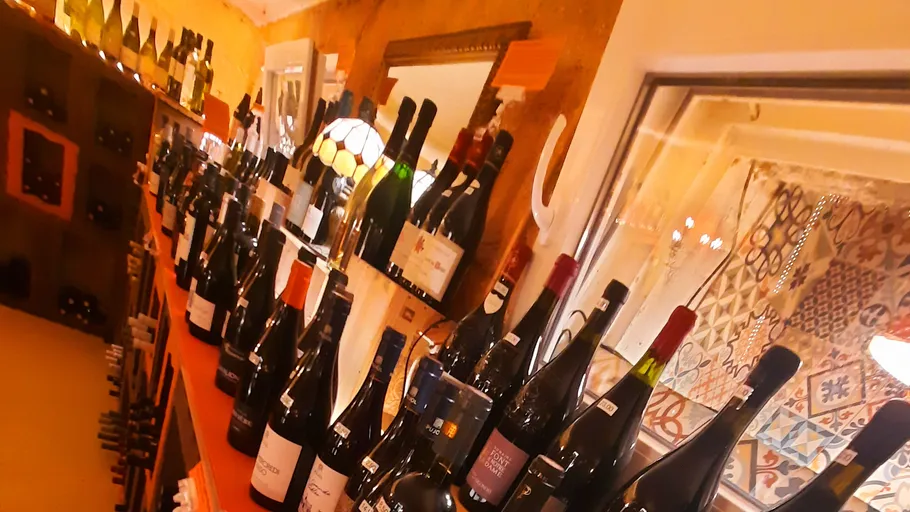 Wine bottles displayed on a shelf in a store.