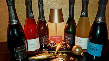 Champagne bottles displayed with decorative ornaments.