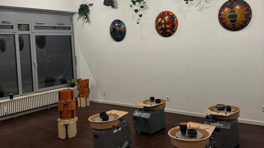 Pottery wheels in a modern studio setting.