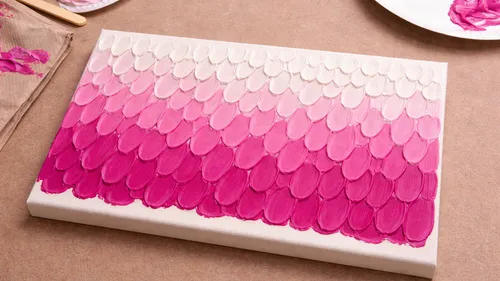 Canvas with pink gradient petal pattern.
