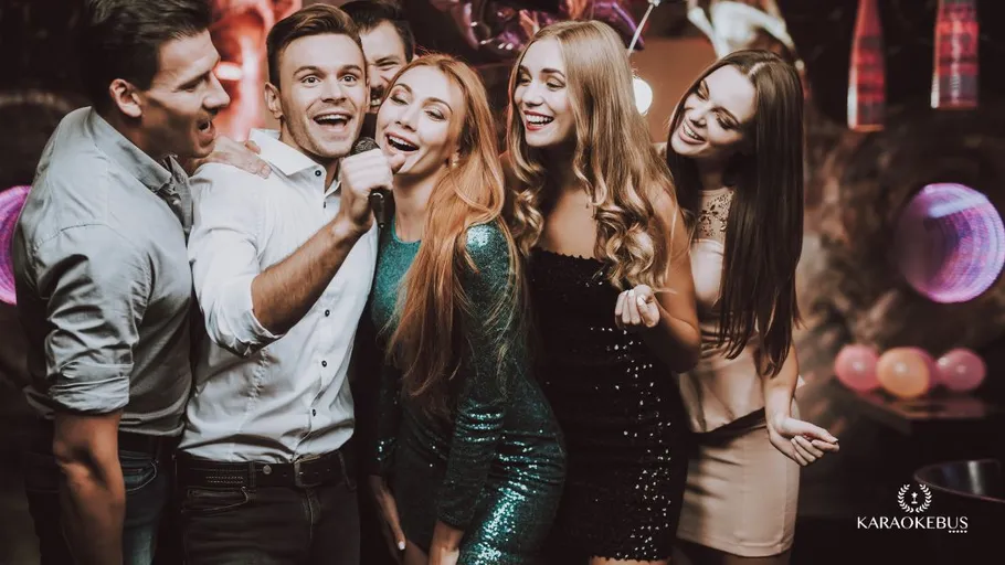 Group of friends singing at a party.
