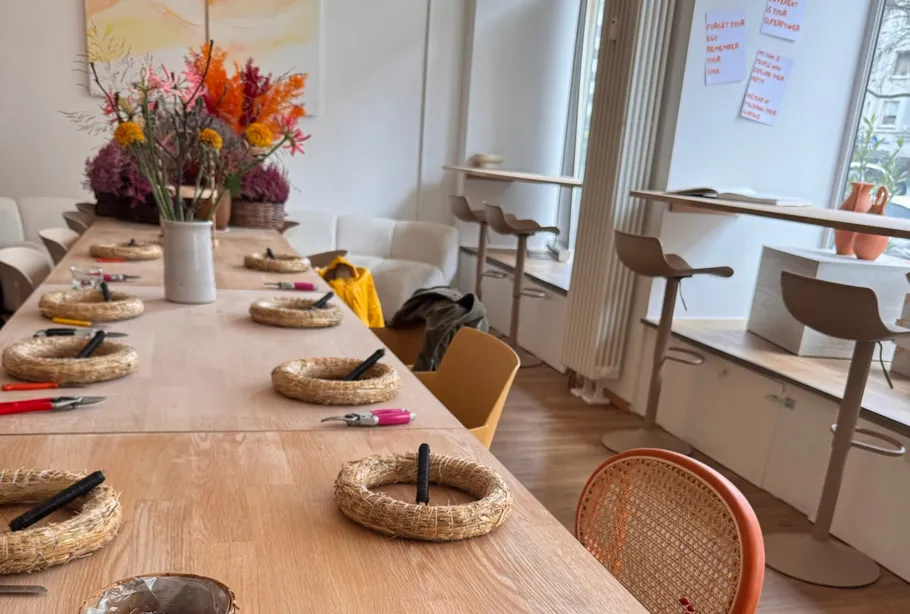 Table set with crafting supplies in cozy room.