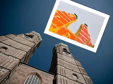 Twin towers under blue sky with artwork overlay.