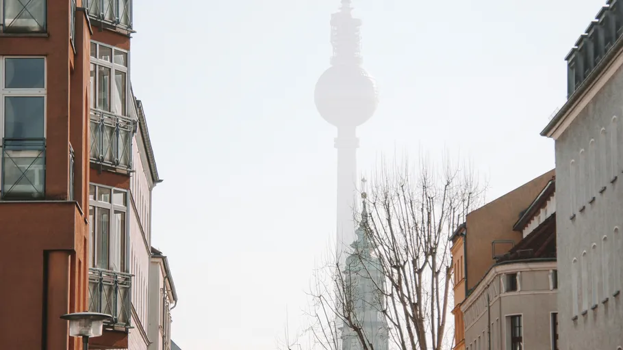 TV tower seen through foggy street view.