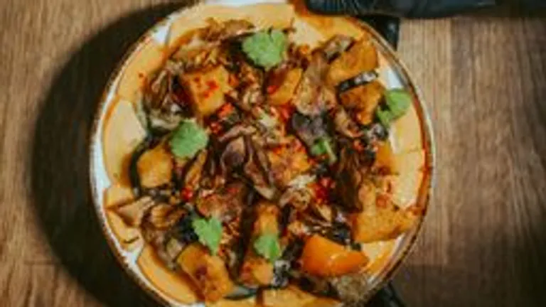 Colorful stir-fry on a wooden table.