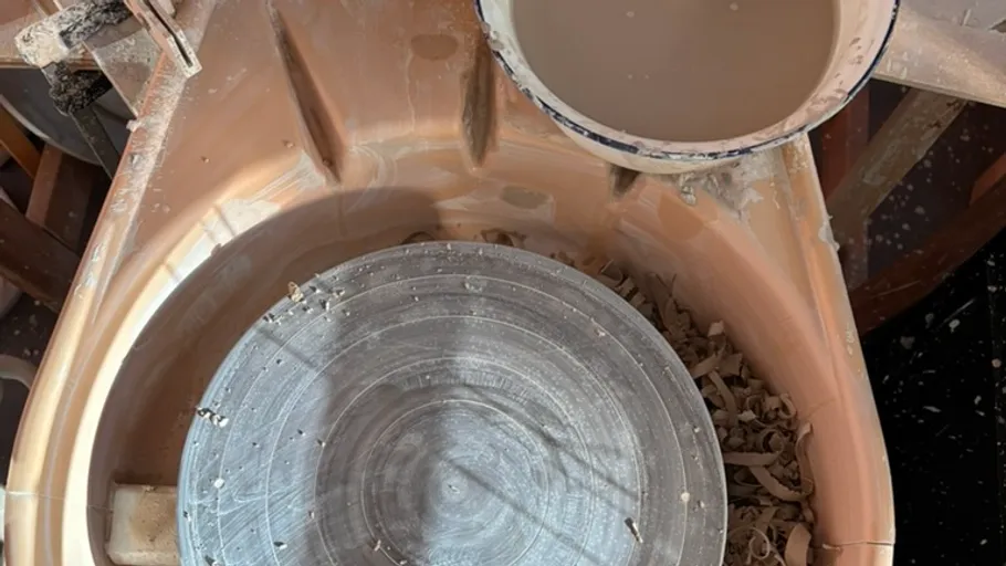 Pottery wheel with wet clay residue