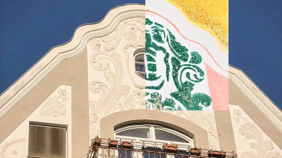 Decorative building facade with abstract overlay.
