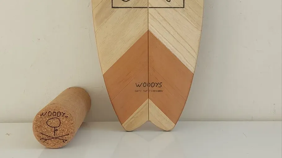 Wood balance board and roller on white surface.