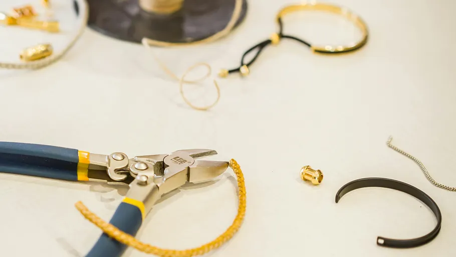 Jewelry tools and materials on a table.