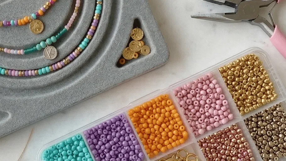 Colorful beads and tools for jewelry making.