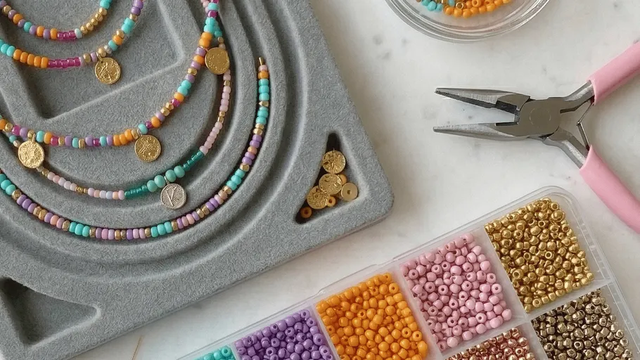 Bead crafts with tools on a table.