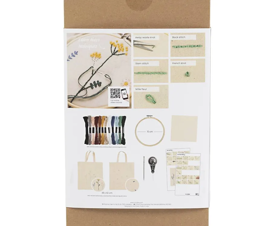Embroidery kit with colorful threads and instructions.