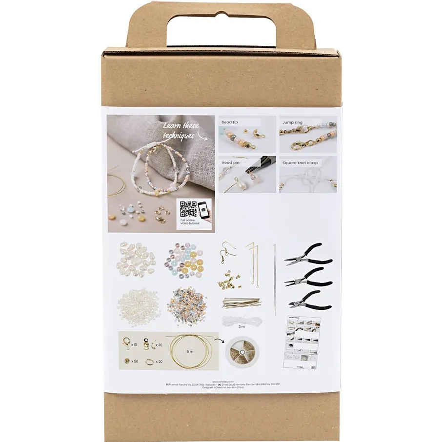 Jewelry making kit with beads and tools.
