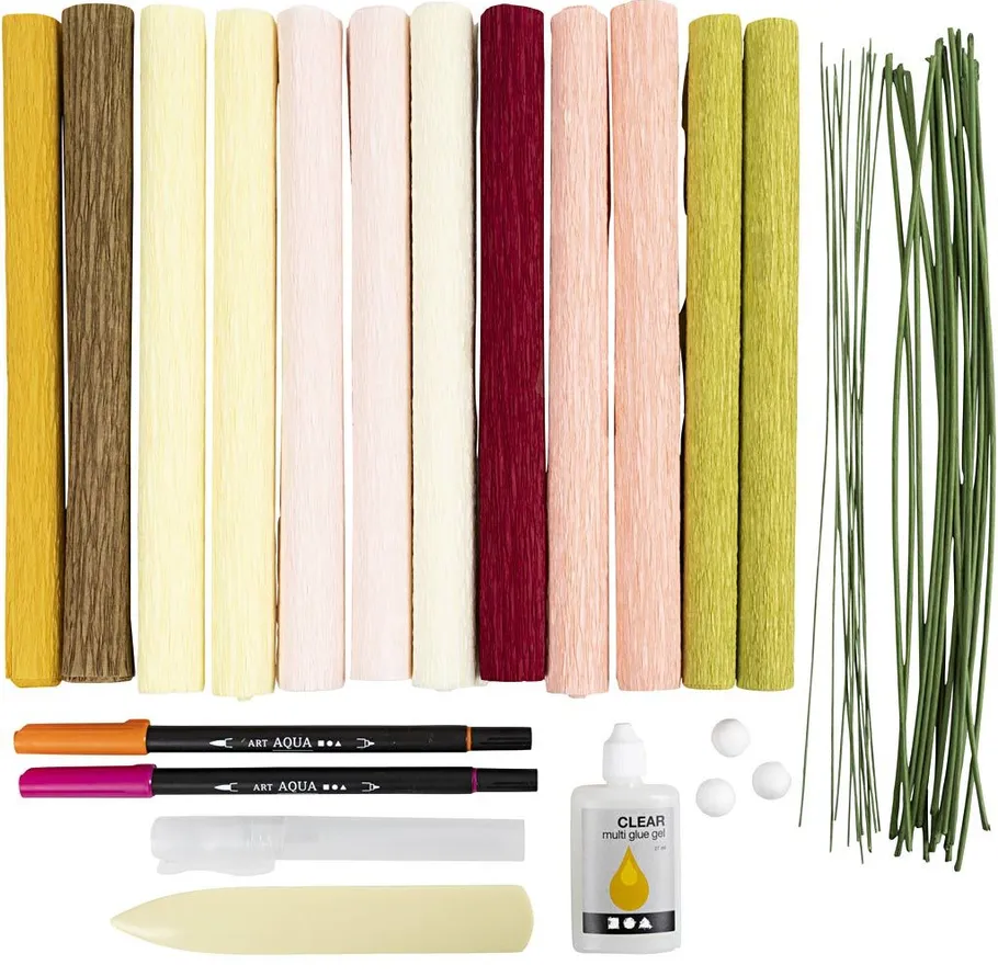 Craft supplies including paper, pens, glue, and sticks.