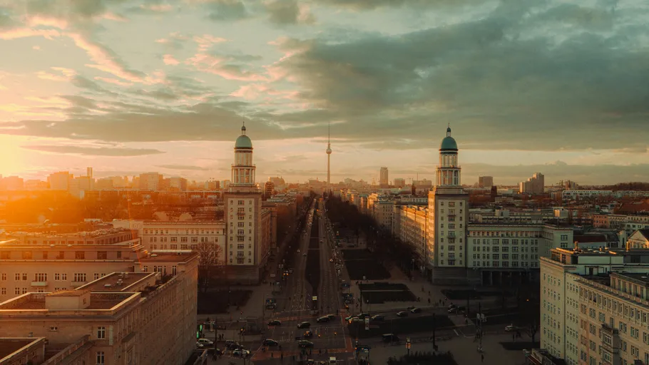 Berlin skyline with sunset over buildings.