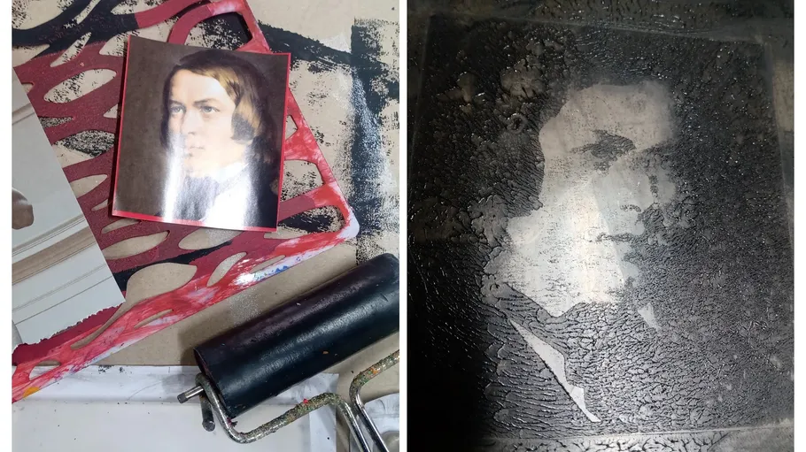 Portrait and printmaking roller on a table.