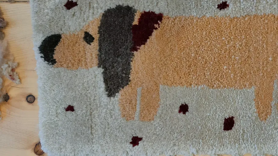 Cartoonish dog illustration on textured rug.