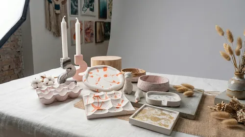 Decorative ceramics and candles on a table display.