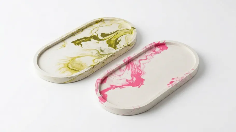 Two marble-patterned oval trays on white background.