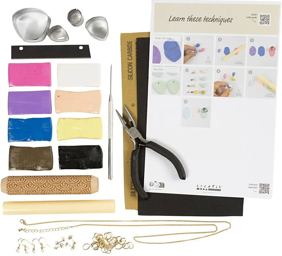 Jewelry-making kit with tools and materials.