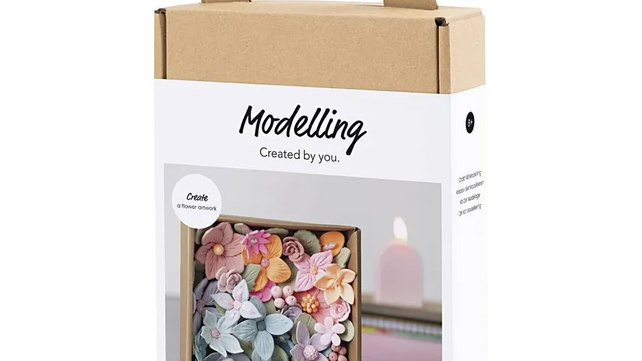 Modeling kit box with floral artwork image.