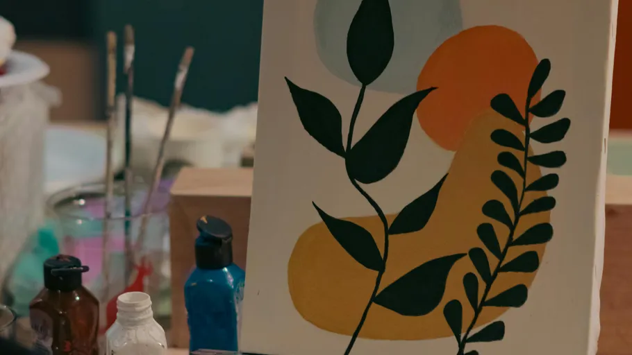 Abstract painting with leaves on canvas.