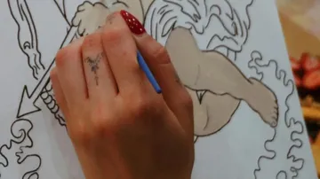 Hand painting detailed sketch on canvas.