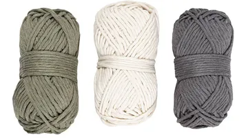 Three yarn skeins in green, white, and gray.