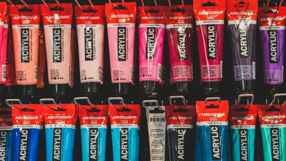 Various colored acrylic paint tubes displayed.