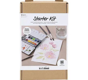 Watercolor starter kit with paints, brushes, paper.