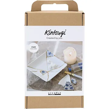 Kintsugi-Set mit repariertem Keramikteller.