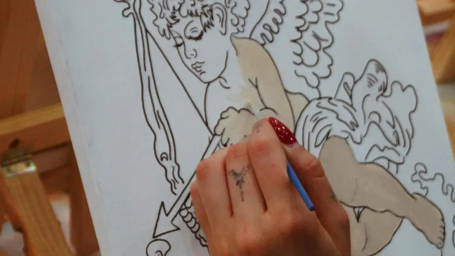 Hand painting angel drawing on canvas.