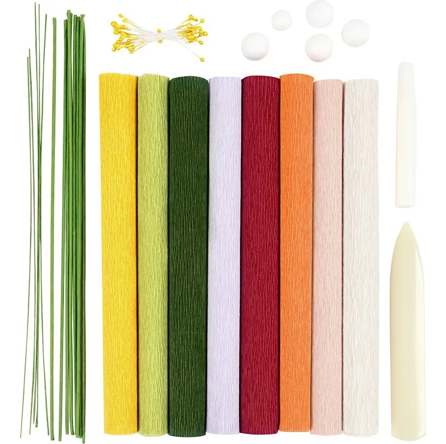Colorful craft materials arranged on white background.