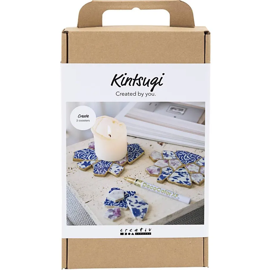 Kintsugi kit with stone pieces and candle.