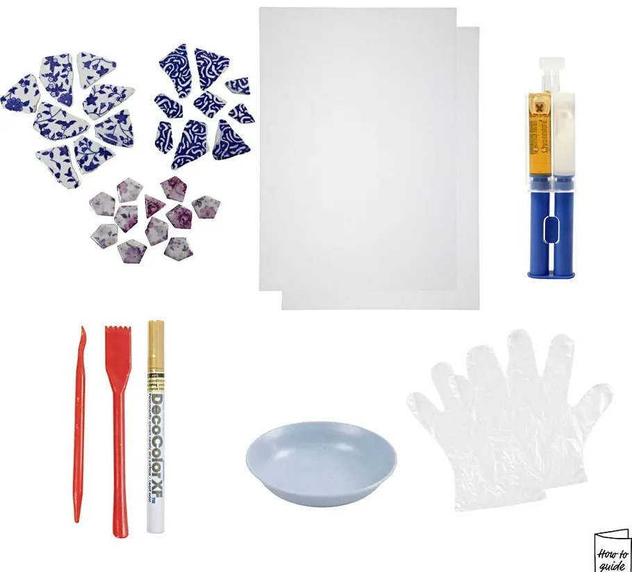 Mosaic kit with tiles, tools, and glue.