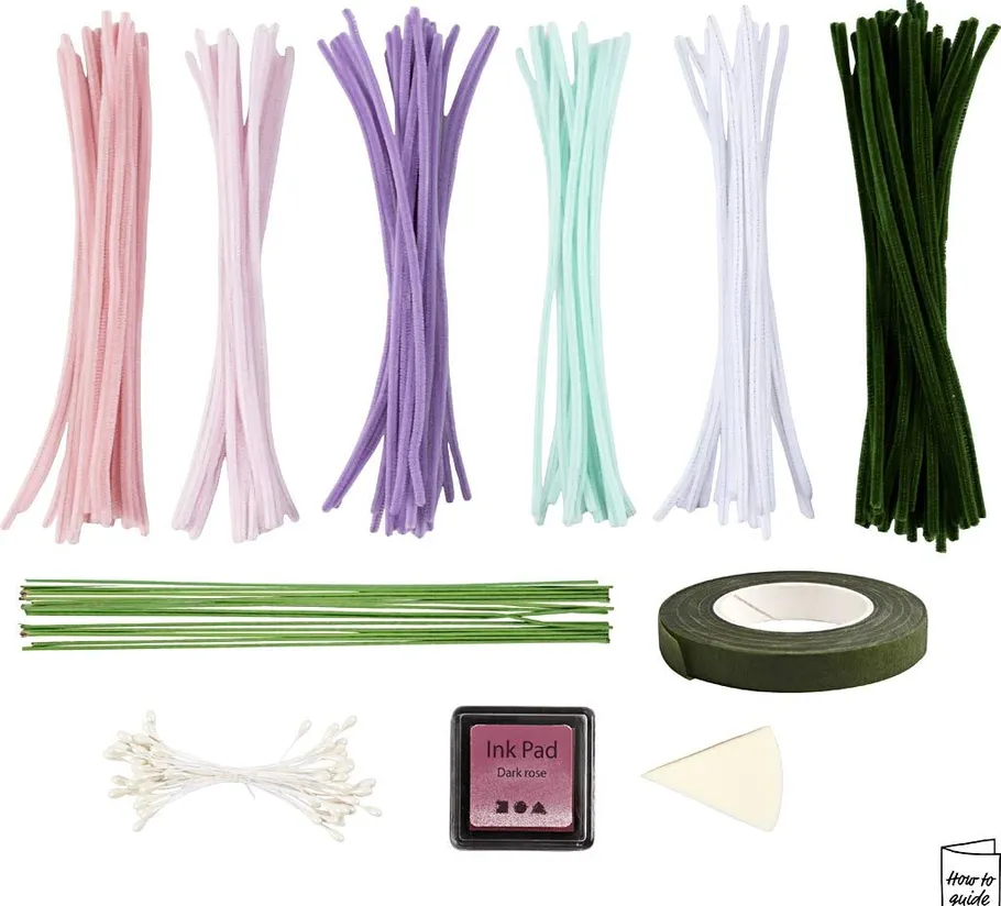Crafting materials with colorful wires, ink pad, tape.