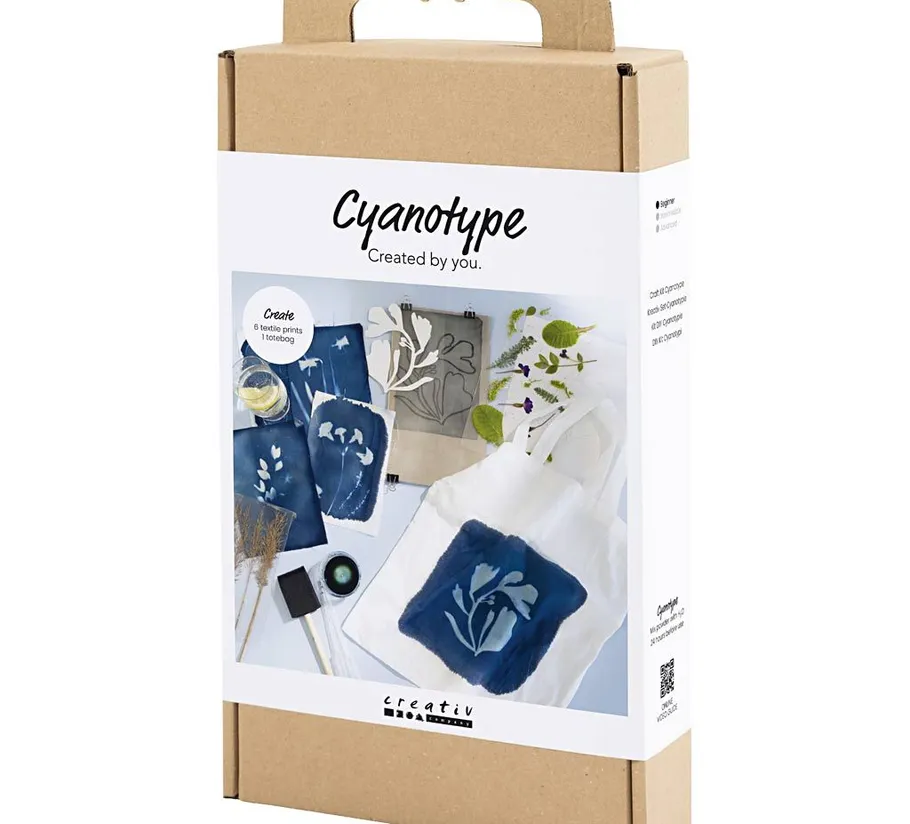 Cyanotype kit with blue textile prints and tote bag.