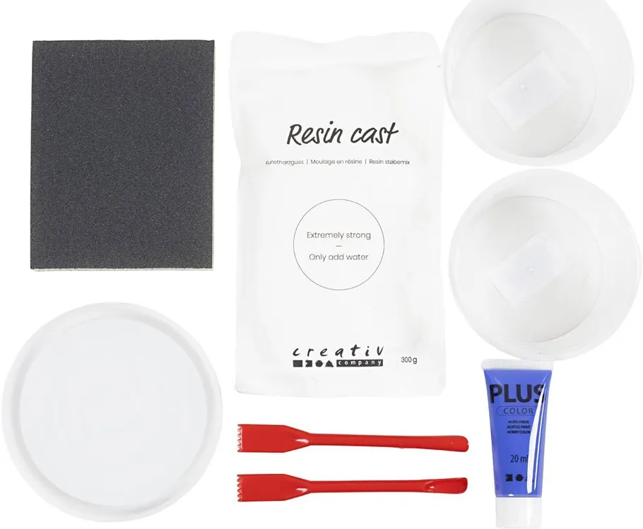 Resin casting kit with tools and materials.