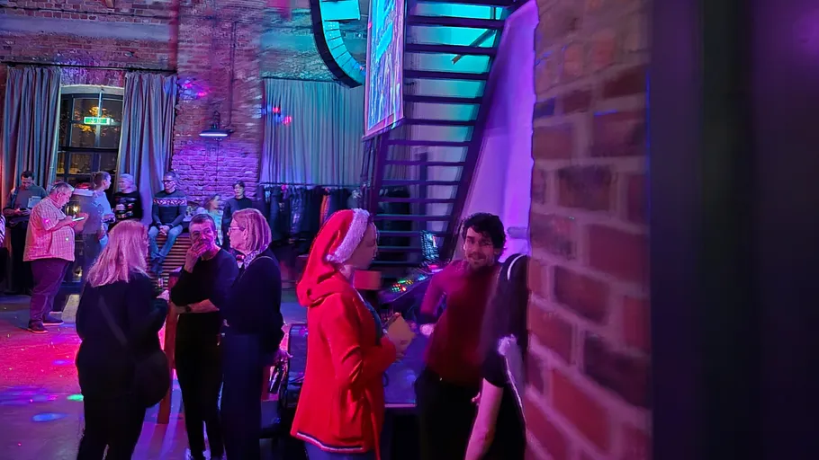 People socializing at a festive indoor event.