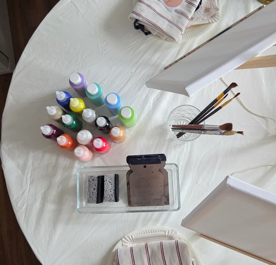 Art supplies on a round table.