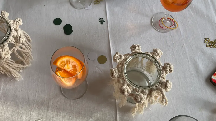 Table with drinks and decorative jars.