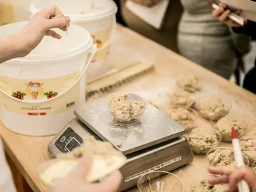 Dough is weighed to fill portions into trays.