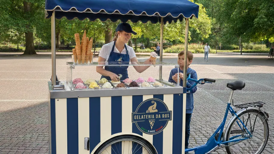 Ice cream vendor serves child in park.