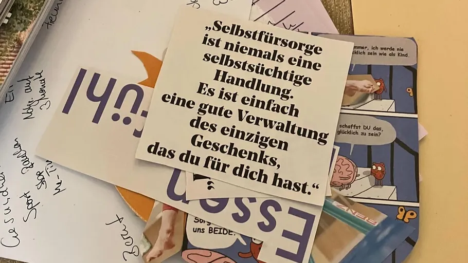 Stack of cards with text on a table.