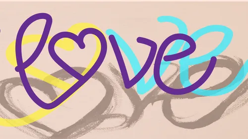 Herzförmiger Love-Text mit bunten Akzenten.